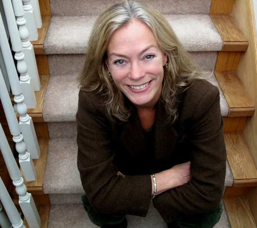 Vancouver City Councillor Colleen Hardwick, sitting on the stairs in her home